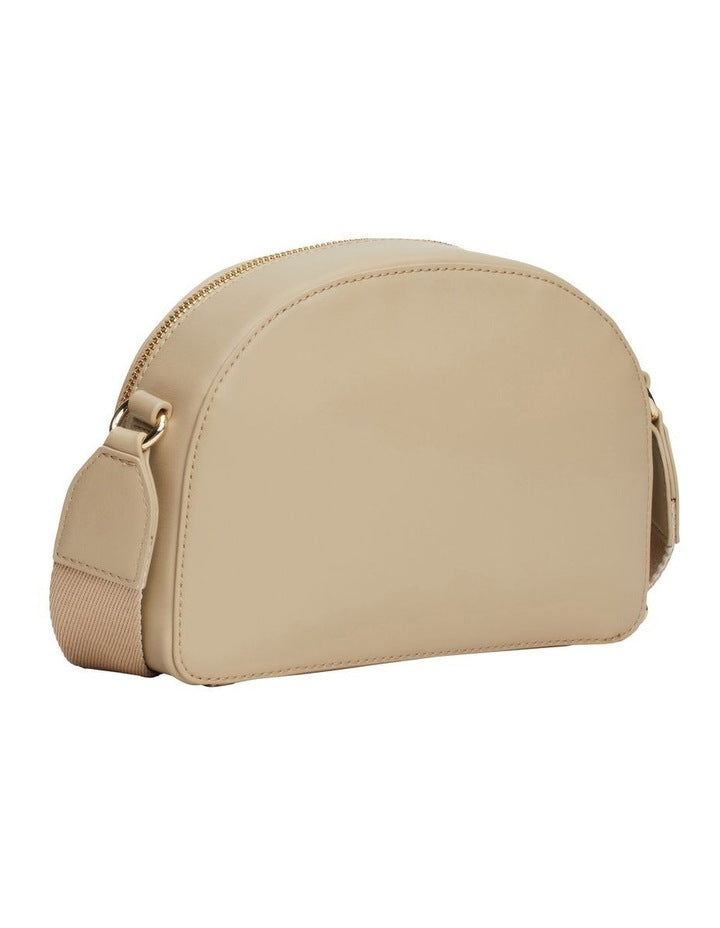 Monotype Half Moon Crossover Bag in Beige