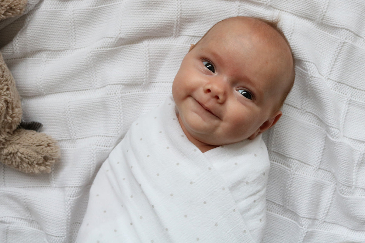 Stretch Muslin Wrap by Little Turtle Baby Color White with Blue Leaves